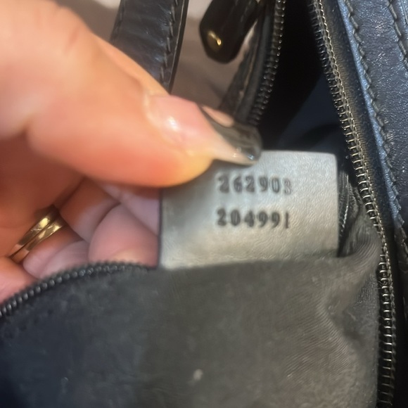 Black Gucci hand bag dims 15 in wide 10 in long on short end 13 in on long. - Picture 5 of 8